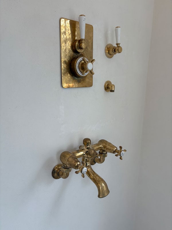 Plaster around shower controls after repair